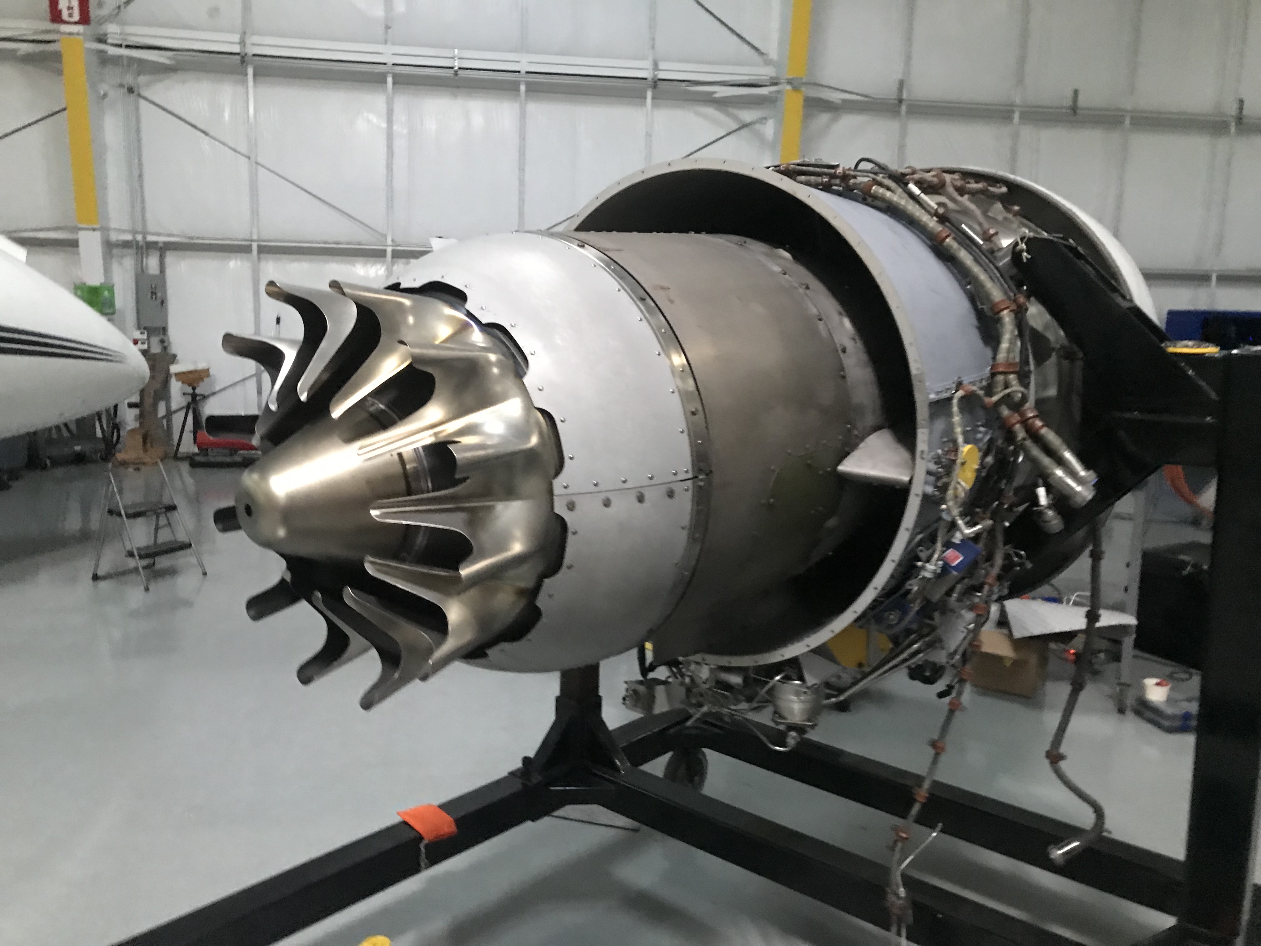 Photo of a partially assembled Pratt and Whitney PW306A Turbofan engine, as mounted on an engine rack